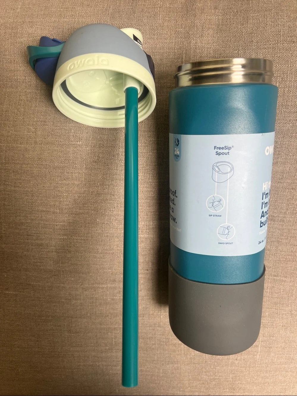 Owala FreeSip Stainless Steel Water Bottle in a 24 oz size blue & teal color